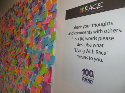 The Rochester Museum & Science Center hosted an early 2013 touring exhibition called Race: Are We So Different? The center created this board in the lobby outside the exhibit for visitors to describe “Living with Race” in six words. The posts were placed on a world map mural that filled a large wall.